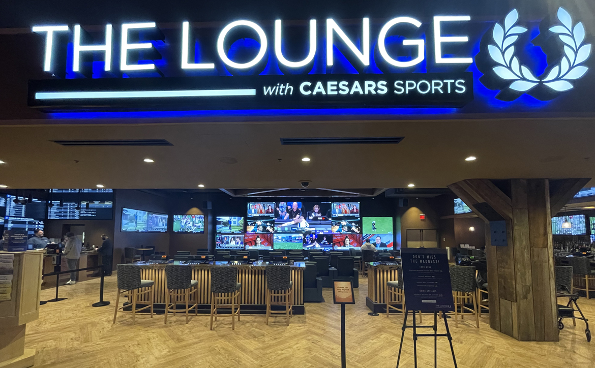 The sports book inside The Lounge with Caesars Sports at Point Place Casino