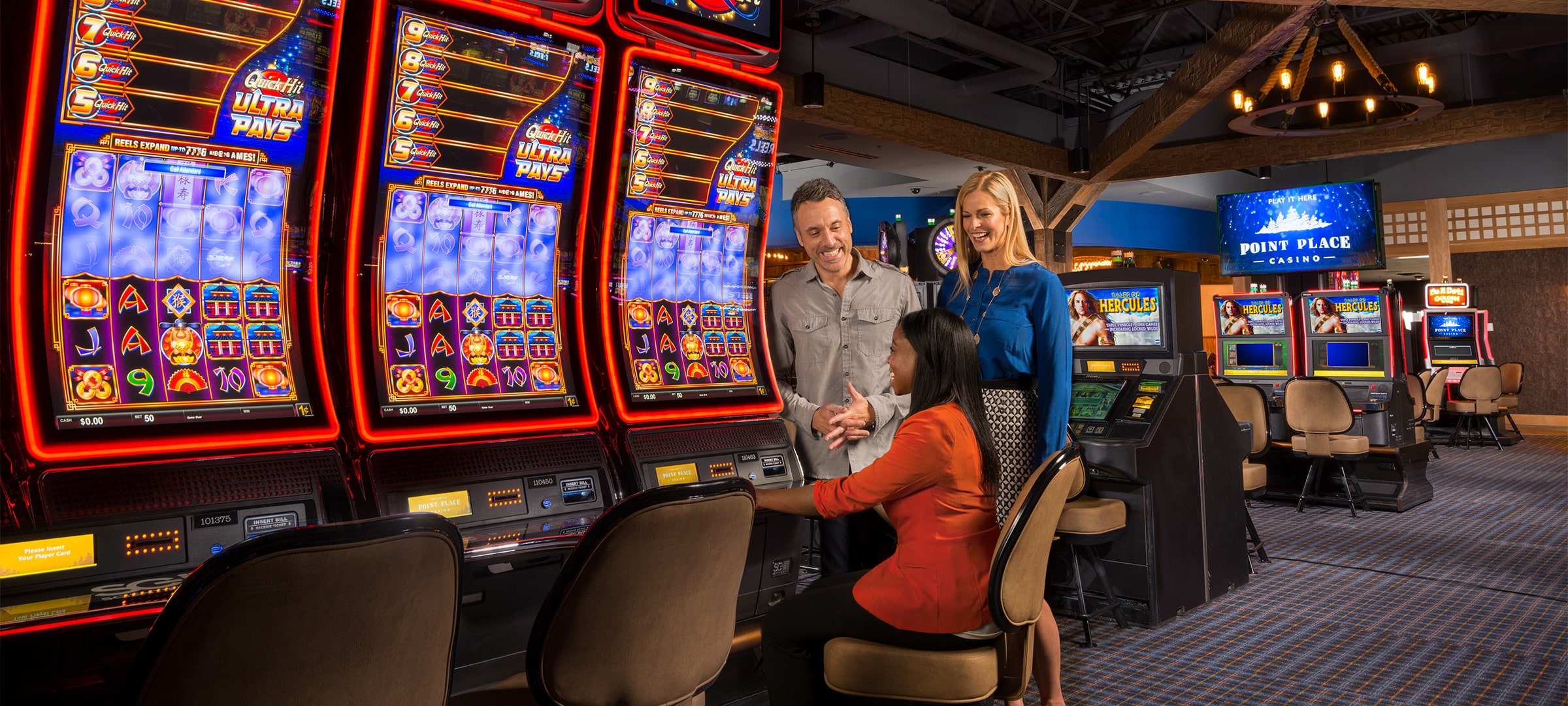 Guest playing Quick Hit Ultra Pays slot machine game next to Tales of Hercules slots at Point Place Casino