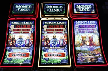 three money link slot machines side by side