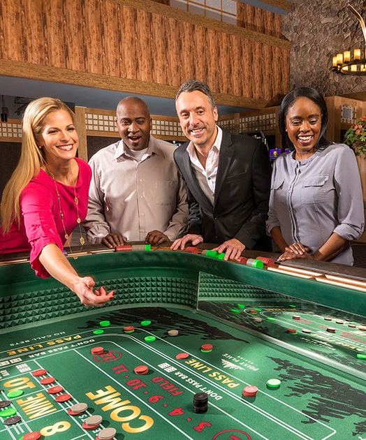 Rolling dice at Point Place Casino craps table