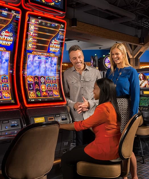 Guest playing Quick Hit Ultra Pays slot machine game at Point Place Casino