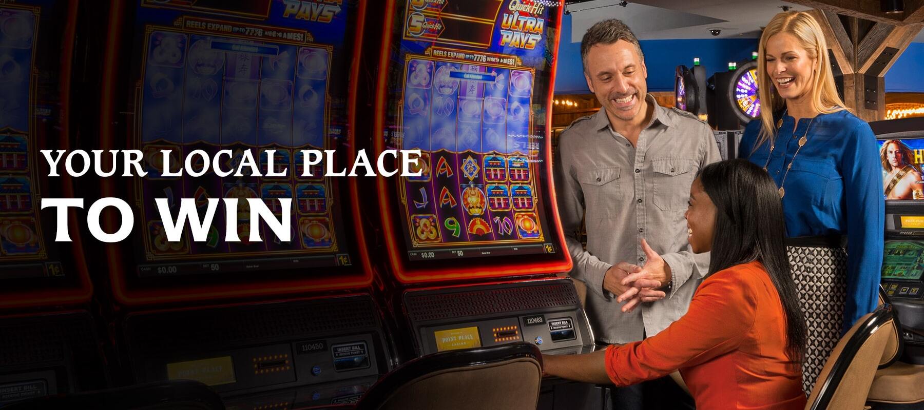 Your local place to win - three friends playing on a slot machine