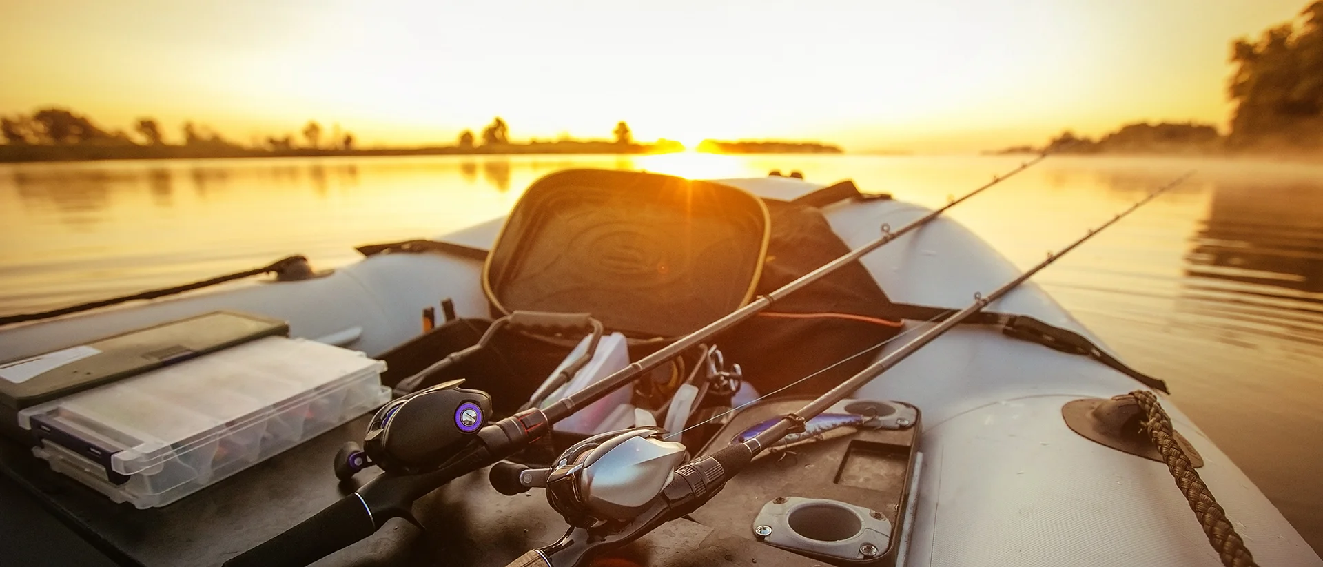 Fishing boat on the lake at sunset