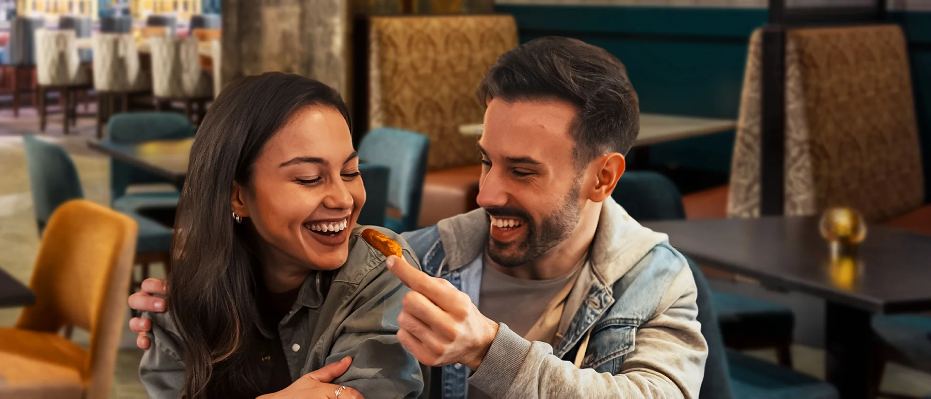 couple enjoying a meal at Point Place Casino Hotel